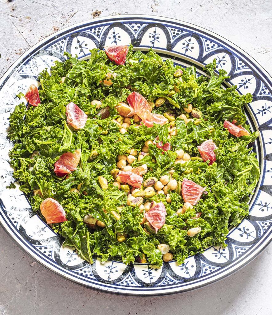kale salad with chickpeas and blood orange in bowl