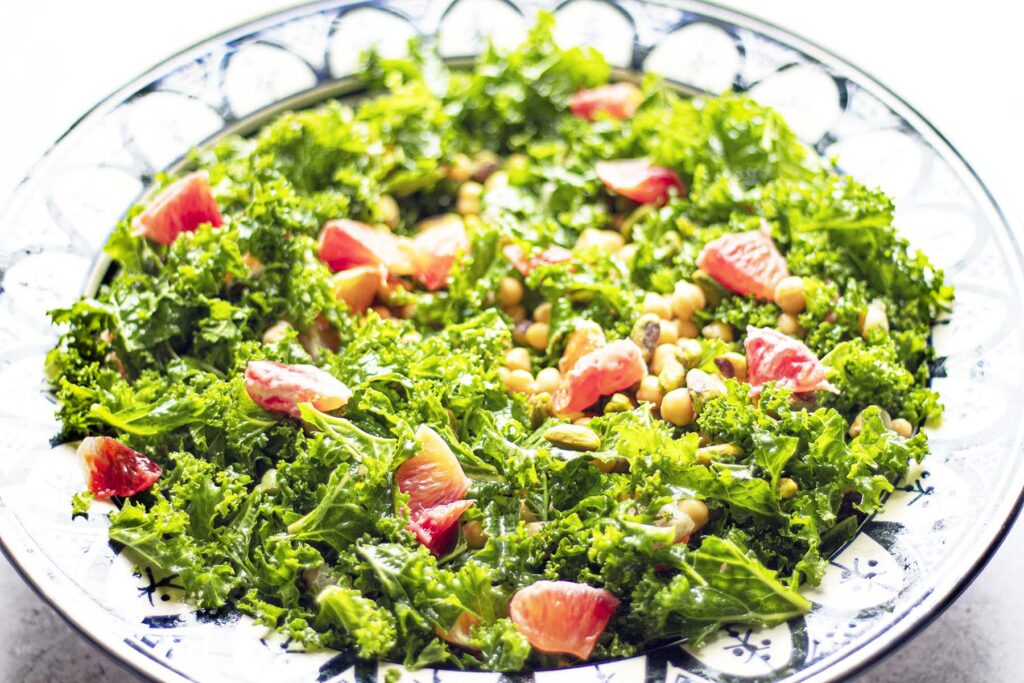 kale salad with chickpeas and blood orange in bowl