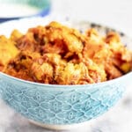 pumpkin curry in blue and white bowl