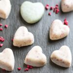 vegan white chocolate hearts on black slate