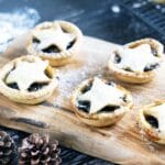 vegan mince pies with star tops on wooden board