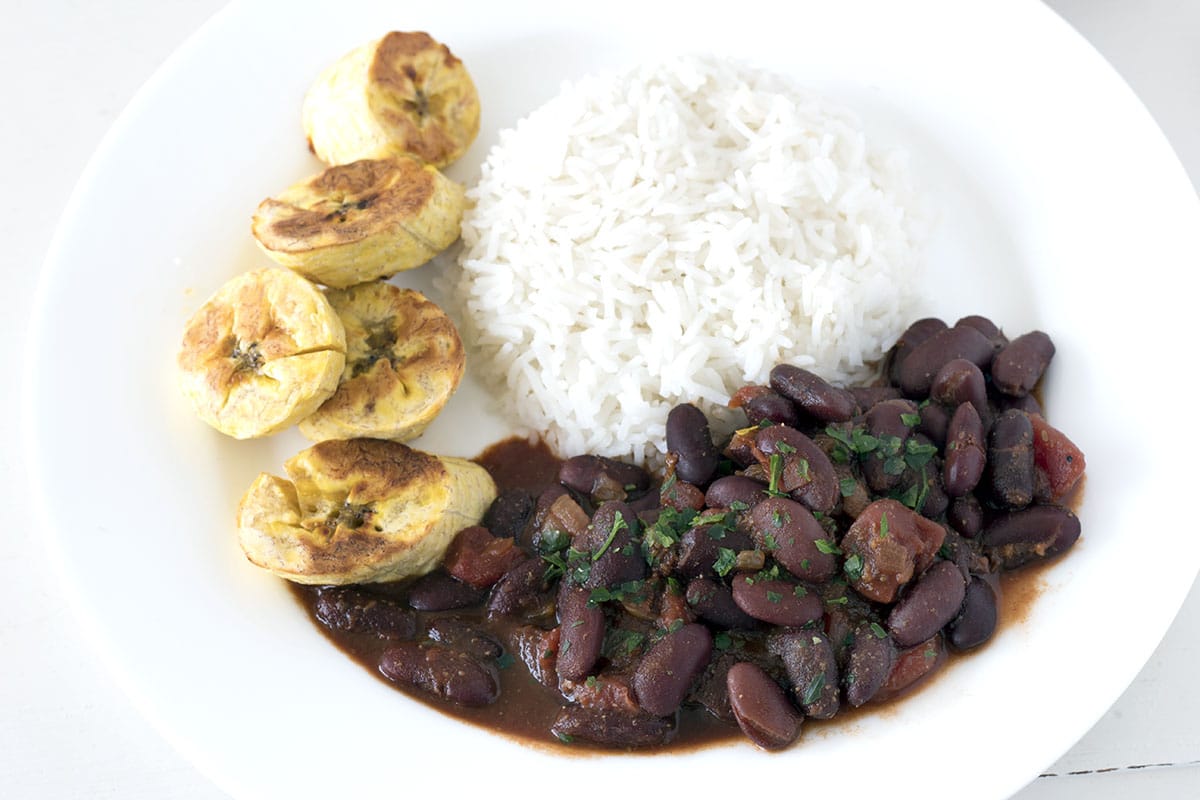Vegan African bean stew with rice and baked plantains