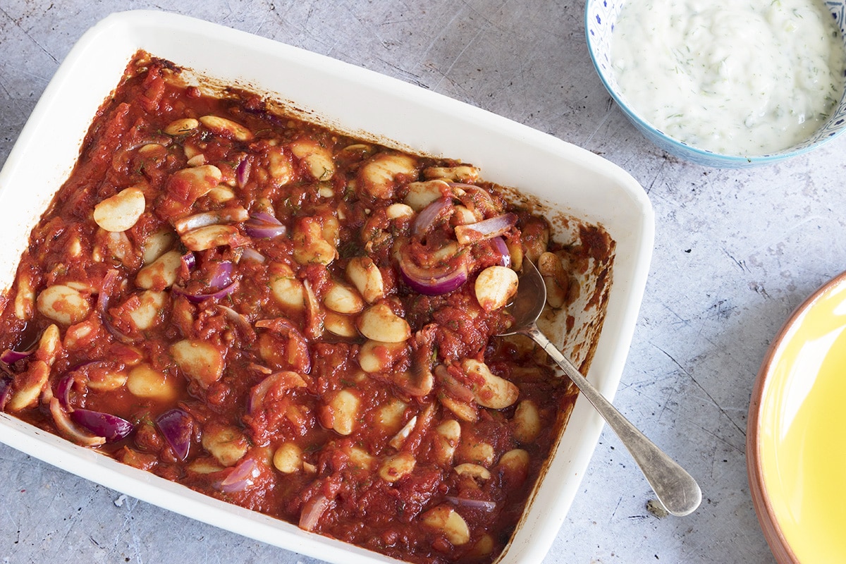 Baked Greek beans with tomato sauce in roasting tine