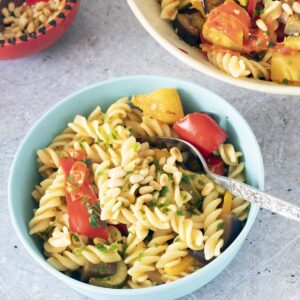 pasta twists and roasted vegetables in bowls
