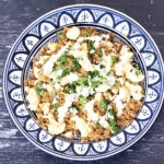 Cauliflower bulgur pilaf in blue and white bowl