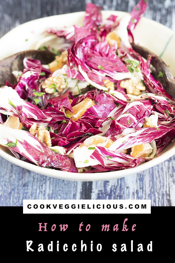 clementine, walnut and radicchio salad in bowl with serving spoons