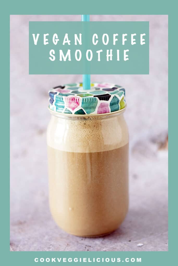 coffee smoothie in glass smoothie jar with straw on grey background