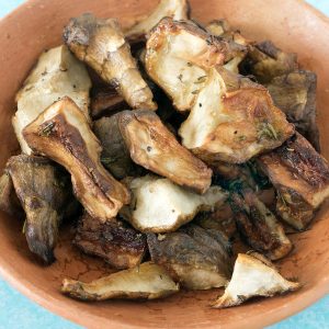 roasted jerusalem artichokes in terracotta bowl