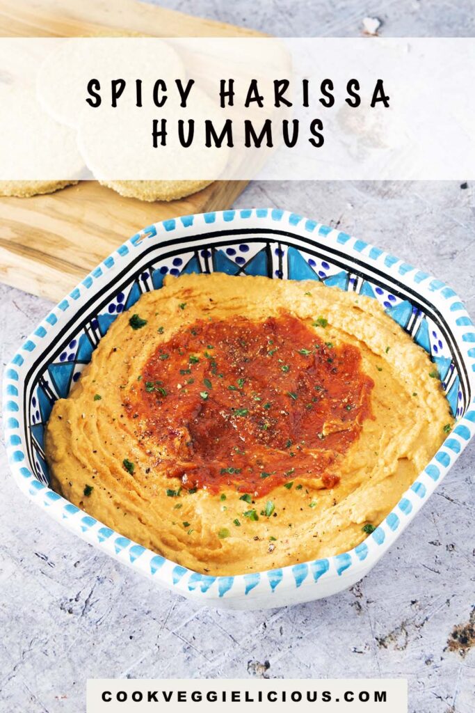 spicy harissa hummus in blue and white bowl