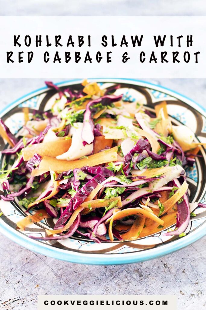slaw with kohlrabi, carrot and red cabbage in blue and white bowl