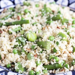 couscous, broad bean, asparagus salad in moroccan blue and white bowl