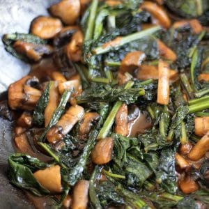 sauteed kale in wok with mushrooms and miso