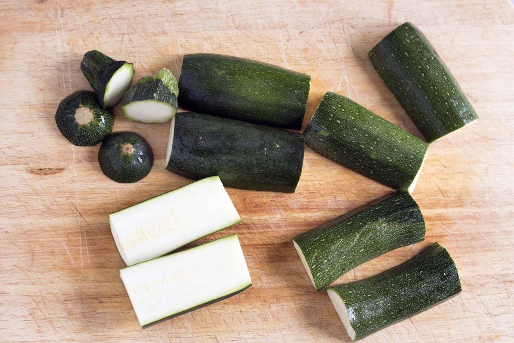 chopped courgettes on wooden board