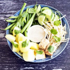 vegan gado gado - salad with beans, potatoes, cucumber, tofu and peanut sauce