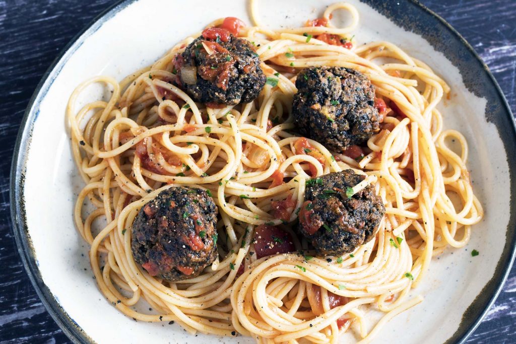 mushroom meatballs and spaghetti on ceramic plate