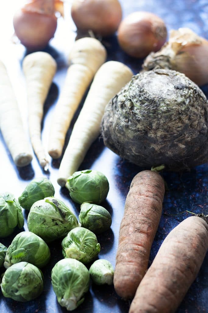 Seasonal vegetable guide December with brussels, carrots, celeriac, parsnip and onion