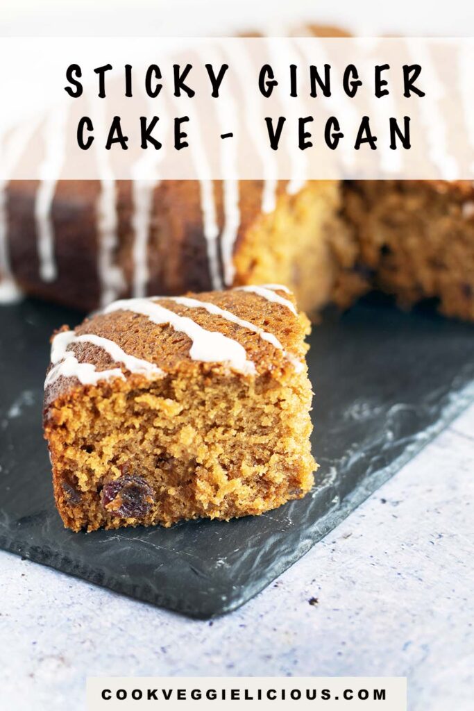 vegan ginger cake with drizzle of icing on slate plate