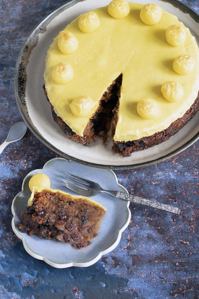 vegan easter simnel cake - overhead shot with one slice cut out