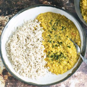 coconut lentil curry and brown rice on plate