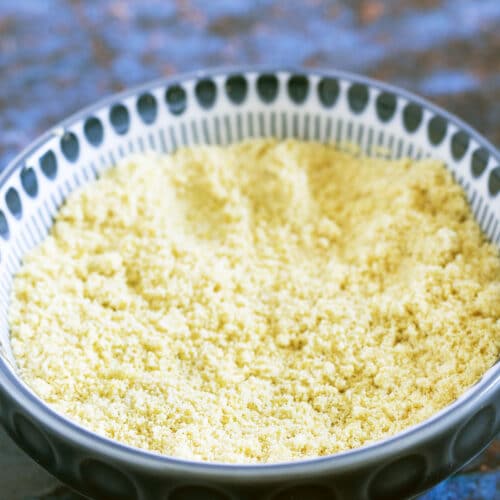 vegan parmesan cheese made with almonds in blue and white bowl