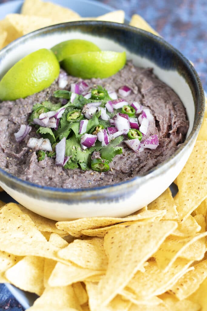 black bean dip in bowl with tortilla chips