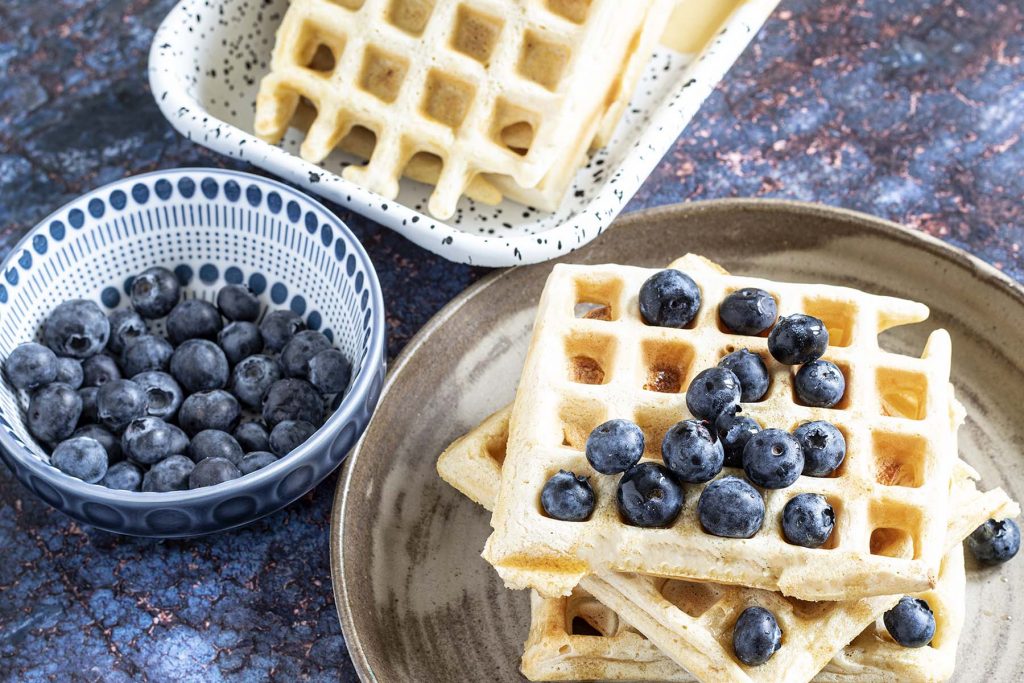 stack of vegan waffles with blueberries