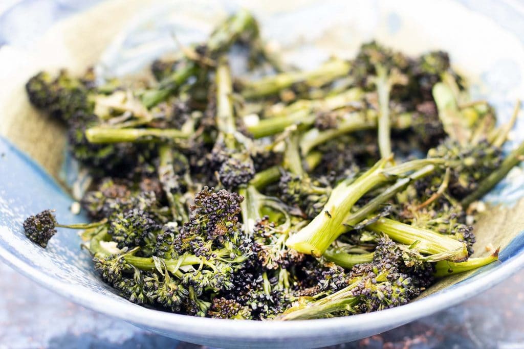 roasted purple sprouting broccoli in bowl