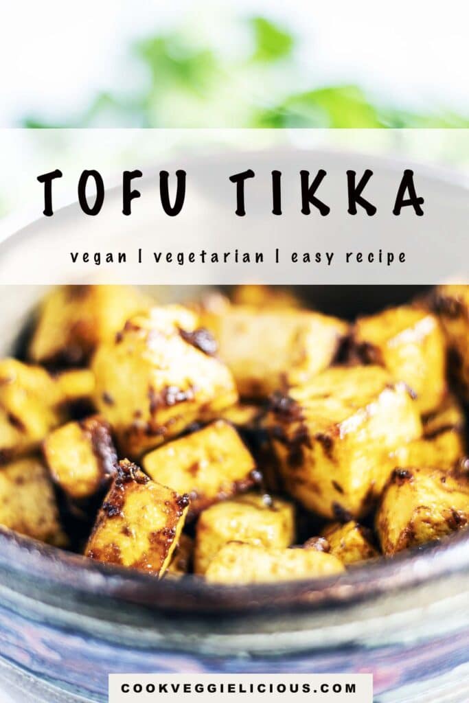 tofu tikka in ceramic bowl with coriander leaves in background