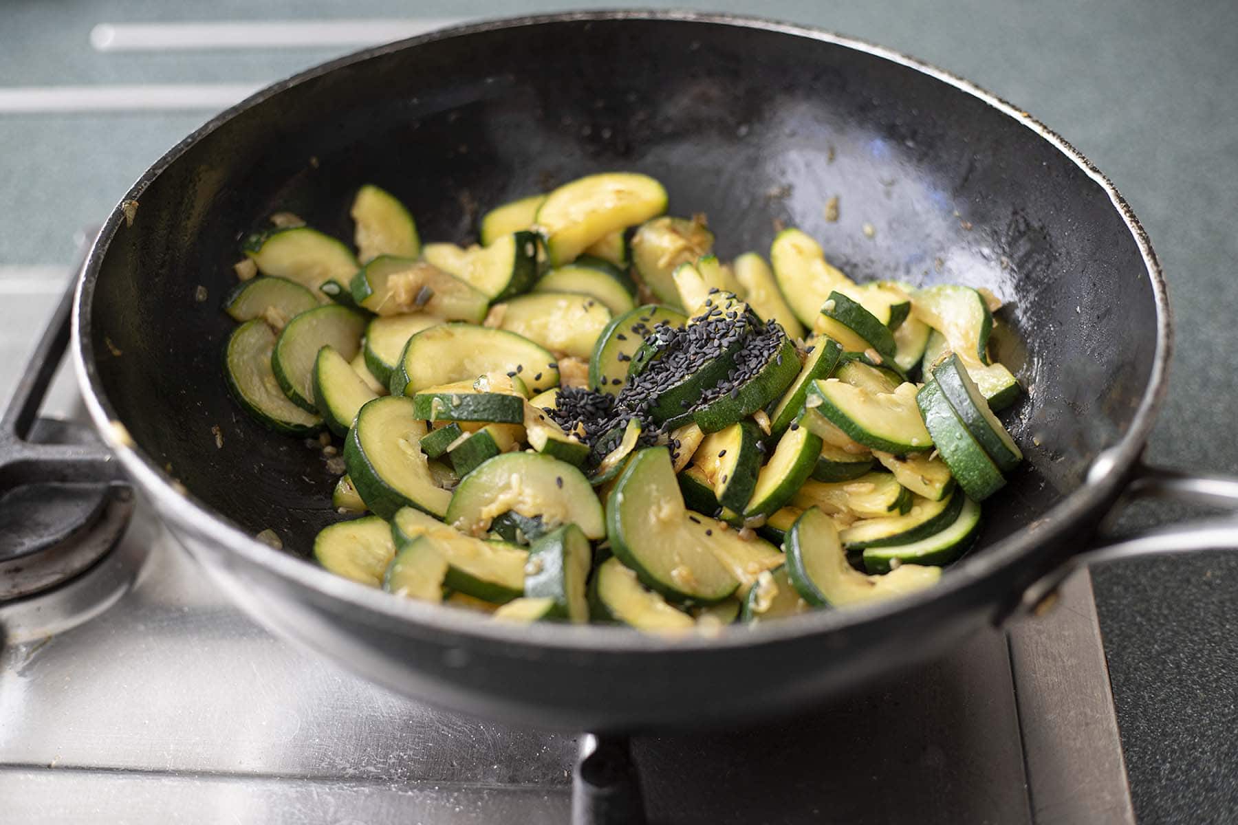courgettes stir frying in wok