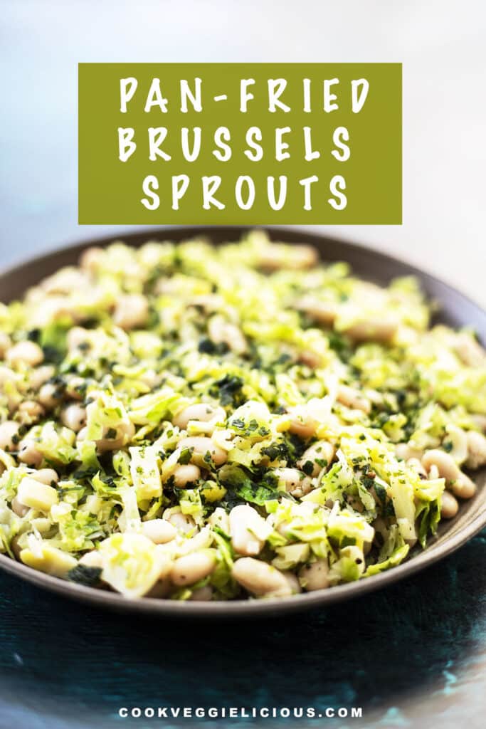 sautéed brussels sprouts with white beans on a ceramic plate